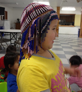 Jocelyn Joseph wearing a beaded head dress made in Port Graham.