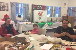 Valdez Native Tribe President John Boone with daughter Sophia and granddaughter Autumn. Autumn has been attending the classes since she was born and John plans on teaching her to hunt soon to keep the tradition alive.